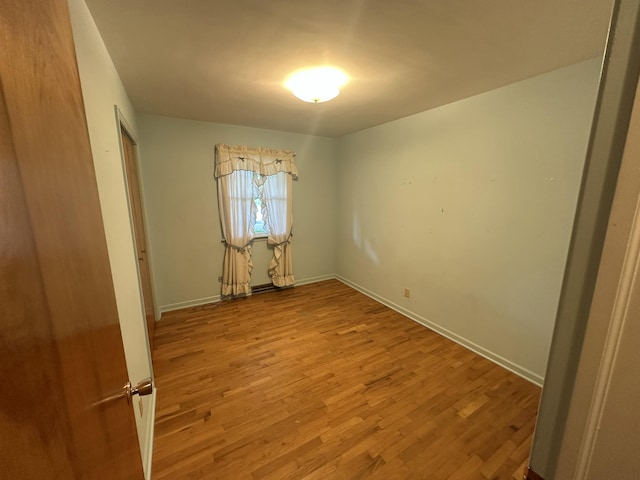 388 Richard St, Spring Arbor, MI 49283 - unfurnished bedroom with wood finished floors and baseboards