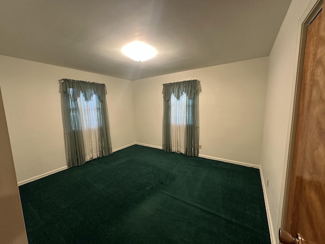 388 Richard St, Spring Arbor, MI 49283 - unfurnished room with dark carpet, healthy amount of natural light, and baseboards