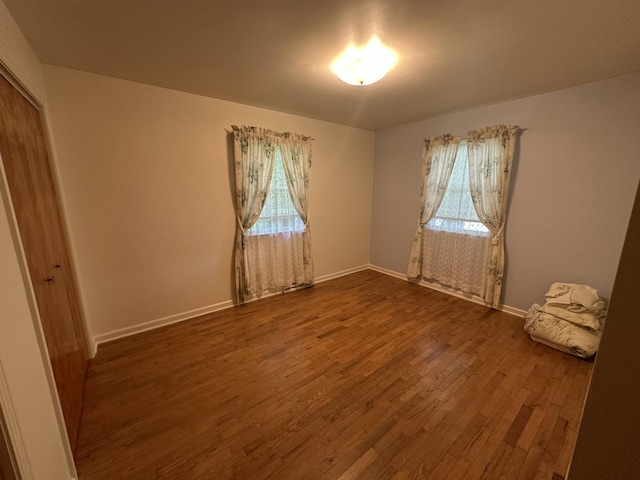 388 Richard St, Spring Arbor, MI 49283 - spare room featuring dark wood finished floors, healthy amount of natural light, and baseboards