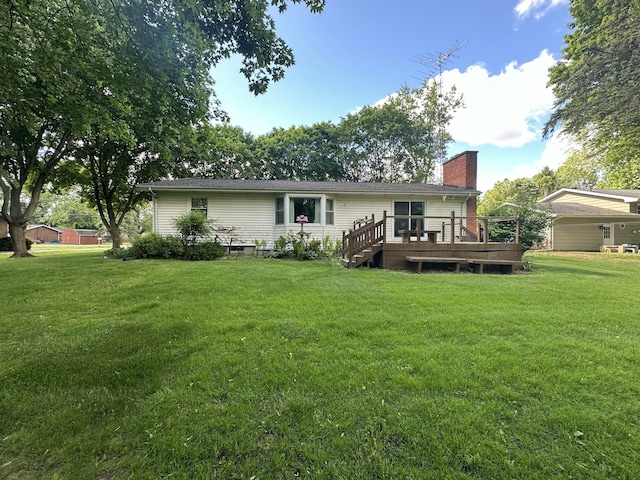 388 Richard St, Spring Arbor, MI 49283 - back of house featuring a chimney, a deck, and a yard