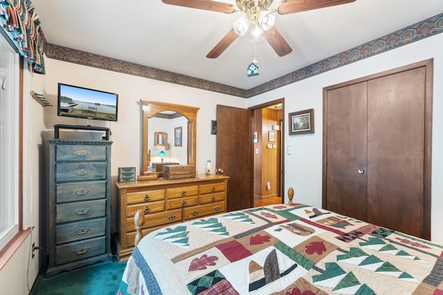 11676 Bradley Dr, Jerome, MI 49249 - bedroom featuring dark colored carpet, a closet, and ceiling fan