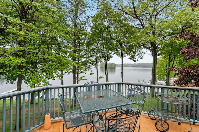 11676 Bradley Dr, Jerome, MI 49249 - wooden deck with a water view and outdoor dining space