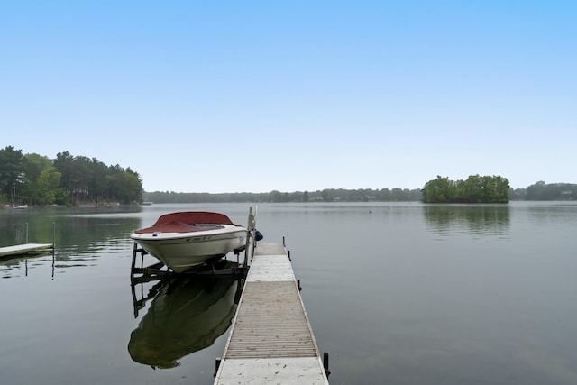 11676 Bradley Dr, Jerome, MI 49249 - dock featuring boat lift and a water view