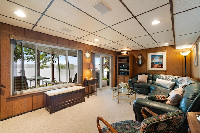 11676 Bradley Dr, Jerome, MI 49249 - living area with wood walls, a water view, light colored carpet, a drop ceiling, and recessed lighting