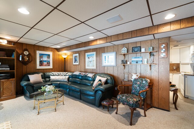 11676 Bradley Dr, Jerome, MI 49249 - carpeted living area with wood walls and recessed lighting