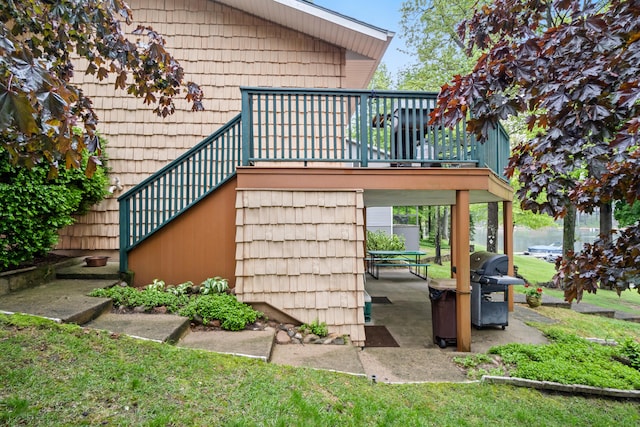 11676 Bradley Dr, Jerome, MI 49249 - view of home's exterior with stairs and a deck