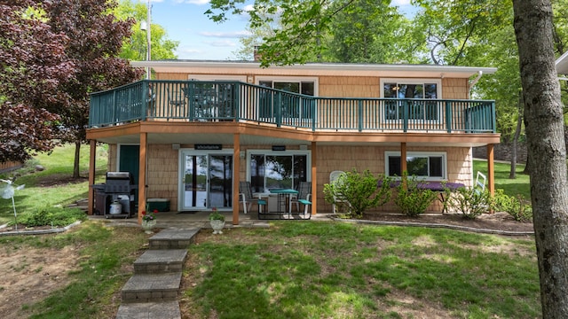 11676 Bradley Dr, Jerome, MI 49249 - view of front facade with a front yard and a wooden deck