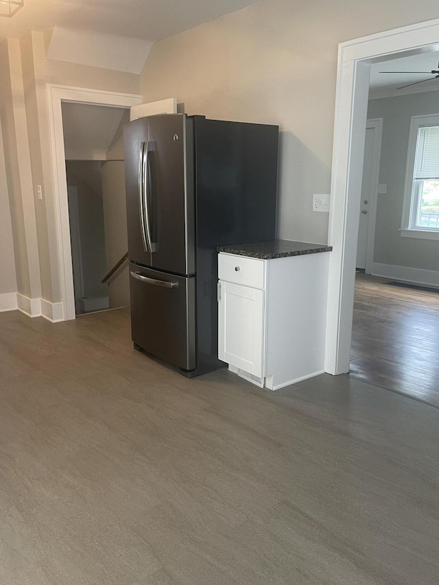 1007 Alto Ave SE, Grand Rapids, MI 49507 - kitchen featuring freestanding refrigerator, white cabinetry, lofted ceiling, and baseboards
