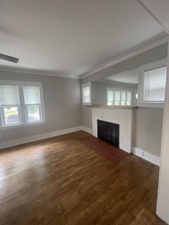1007 Alto Ave SE, Grand Rapids, MI 49507 - unfurnished living room with crown molding, dark wood finished floors, baseboards, a fireplace, and a ceiling fan