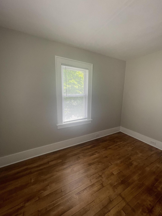 1007 Alto Ave SE, Grand Rapids, MI 49507 - unfurnished room featuring dark wood finished floors and baseboards