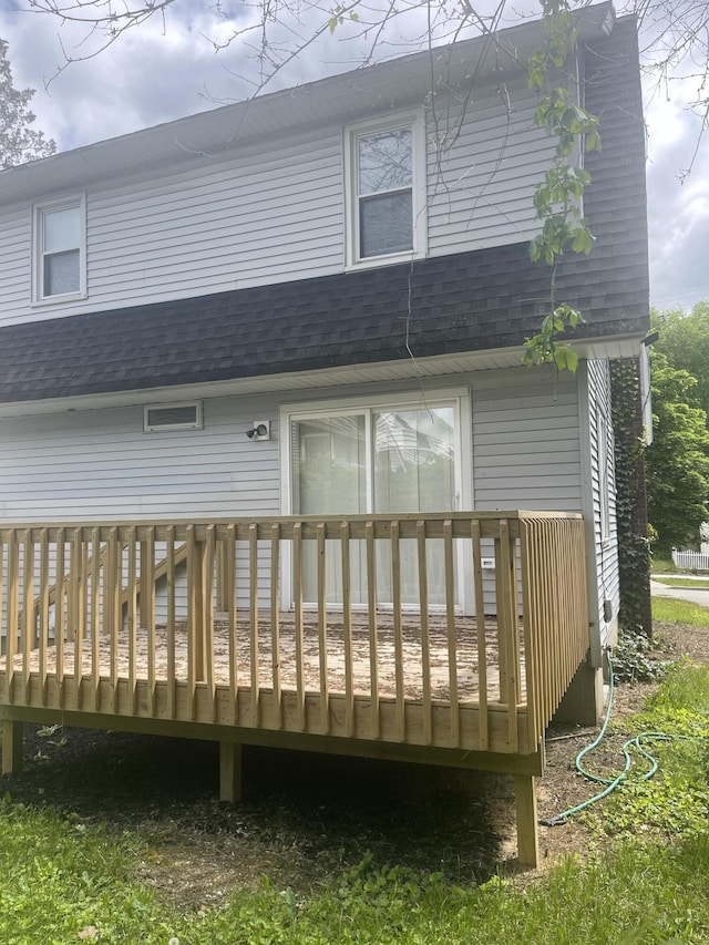 1007 Alto Ave SE, Grand Rapids, MI 49507 - rear view of house featuring roof with shingles and a deck
