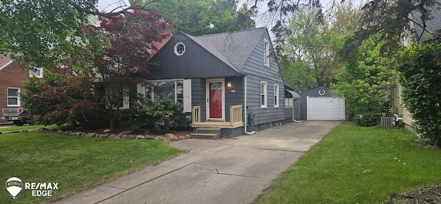 601 Greenfield Ave, Flint, MI 48503 - view of front of home with an outdoor structure, driveway, cooling unit, a garage, and a front yard