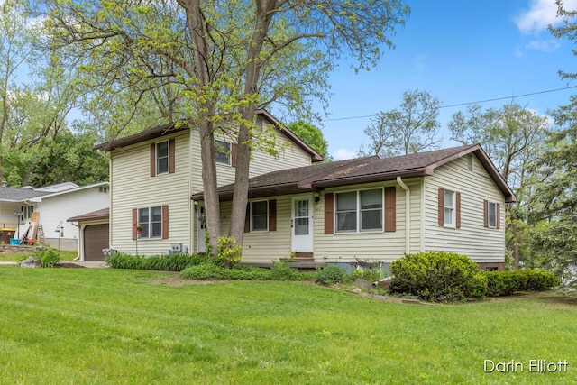 604/606 N New Dexter St, Ionia, MI 48846 - view of front facade featuring a front lawn and an attached garage