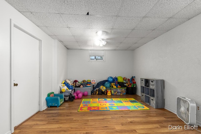 604/606 N New Dexter St, Ionia, MI 48846 - rec room featuring wood finished floors and a paneled ceiling