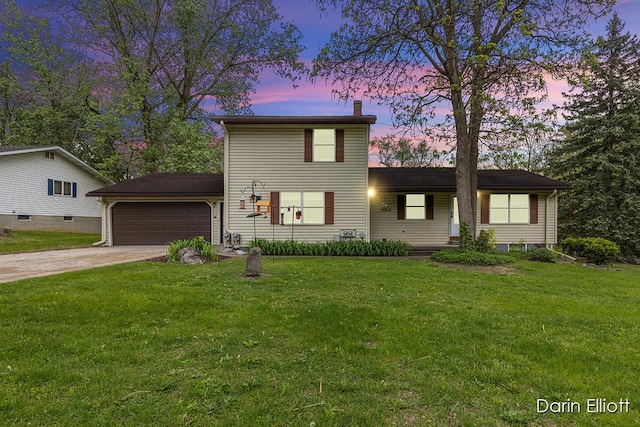 604/606 N New Dexter St, Ionia, MI 48846 - traditional home featuring an attached garage, a chimney, driveway, and a front yard