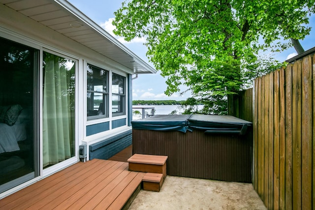 67881 Edgewater Beach Rd, White Pigeon, MI 49099 - wooden deck featuring a hot tub, a water view, and a patio