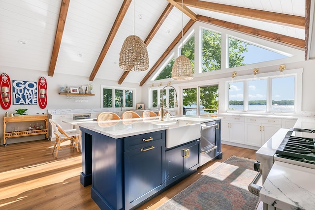 67881 Edgewater Beach Rd, White Pigeon, MI 49099 - kitchen with a sink, wooden ceiling with exposed beams, a center island with sink, white cabinets, and light wood-style flooring