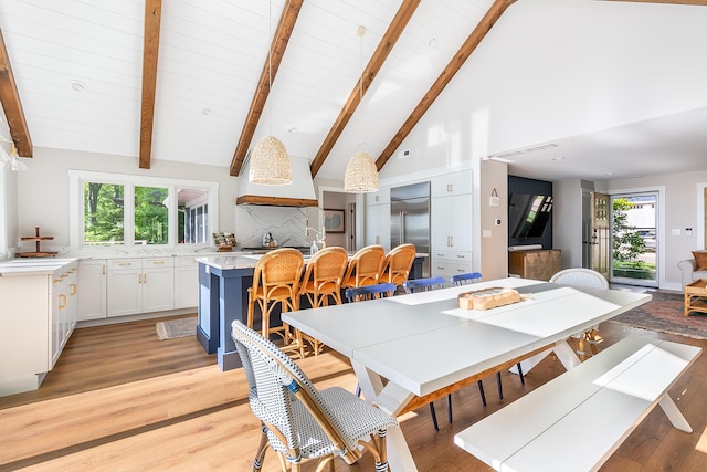 67881 Edgewater Beach Rd, White Pigeon, MI 49099 - dining space featuring light wood-style flooring, wood ceiling with exposed beams, and high vaulted ceiling