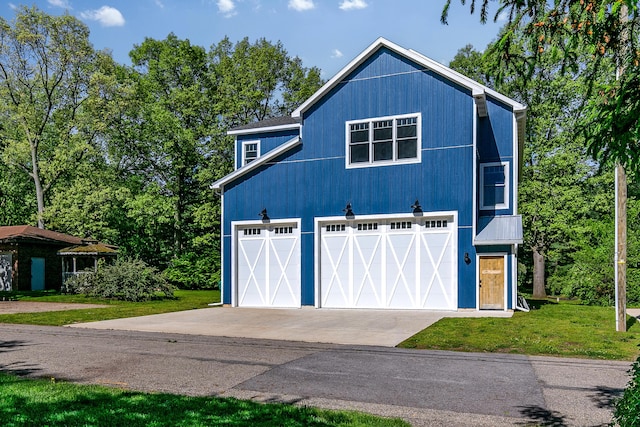 67881 Edgewater Beach Rd, White Pigeon, MI 49099 - view of front of house featuring a front lawn and concrete driveway