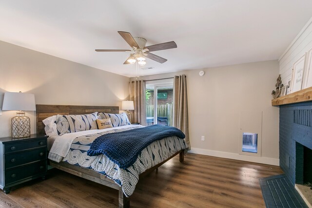 67881 Edgewater Beach Rd, White Pigeon, MI 49099 - bedroom featuring a brick fireplace, wood finished floors, access to exterior, baseboards, and ceiling fan