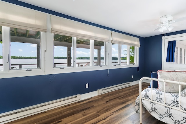 67881 Edgewater Beach Rd, White Pigeon, MI 49099 - bedroom with a baseboard heating unit, dark wood-style floors, a water view, and a ceiling fan