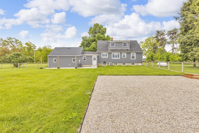 4380 W Chicago Rd, Jonesville, MI 49250 - back of property featuring a patio and a chimney