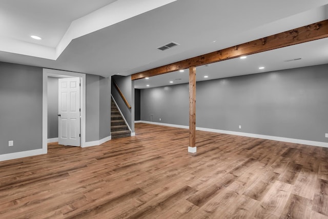 4380 W Chicago Rd, Jonesville, MI 49250 - finished below grade area with wood finished floors, baseboards, stairs, and recessed lighting