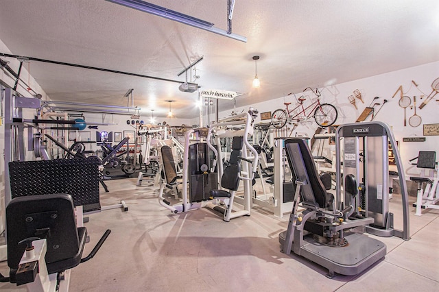 2985 Middle Lake Rd, Twin Lake, MI 49457 - gym featuring a textured ceiling and a garage
