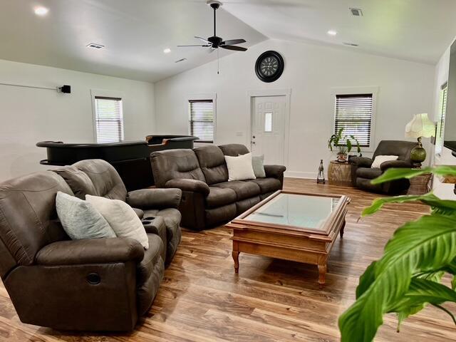 2985 Middle Lake Rd, Twin Lake, MI 49457 - living room with ceiling fan, vaulted ceiling, wood finished floors, healthy amount of natural light, and billiards table
