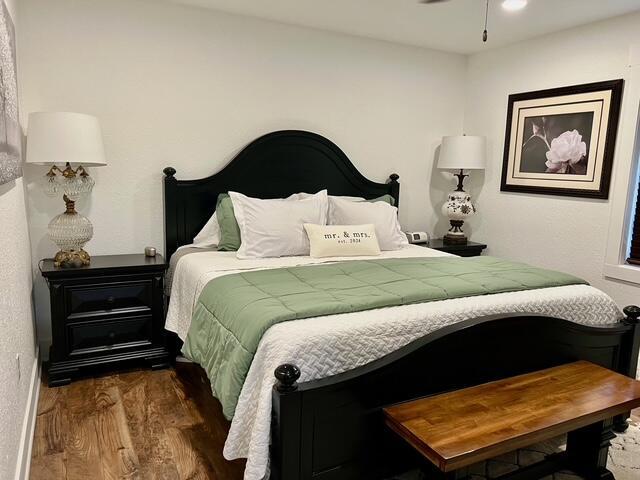 2985 Middle Lake Rd, Twin Lake, MI 49457 - bedroom featuring wood finished floors