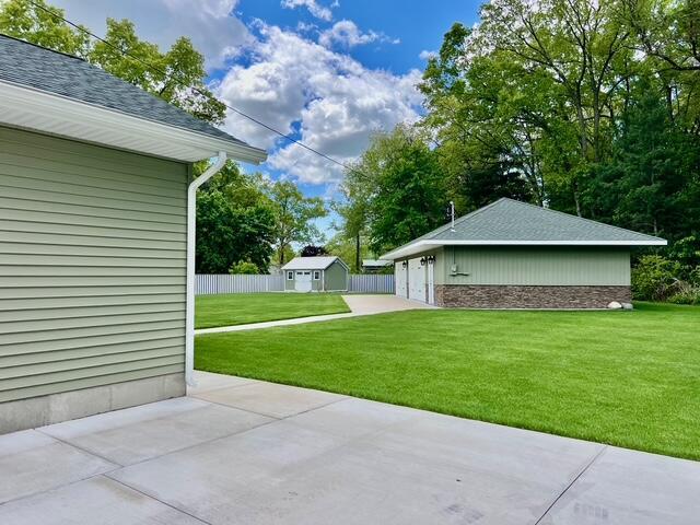 2985 Middle Lake Rd, Twin Lake, MI 49457 - view of patio / terrace featuring an outdoor structure and a detached garage