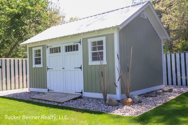 2985 Middle Lake Rd, Twin Lake, MI 49457 - view of shed with a fenced backyard
