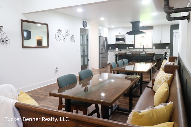 2985 Middle Lake Rd, Twin Lake, MI 49457 - dining room with wood finished floors, baseboards, recessed lighting, and washer / clothes dryer