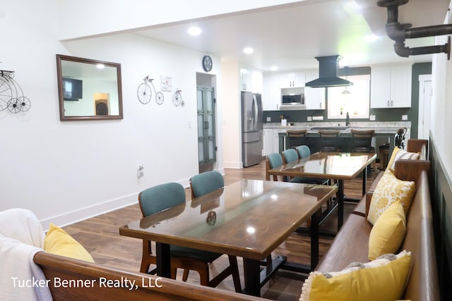 2985 Middle Lake Rd, Twin Lake, MI 49457 - dining area featuring wood finished floors, baseboards, and recessed lighting