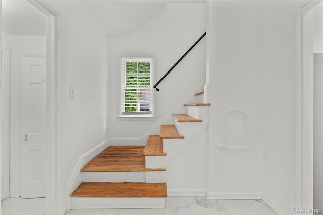 10576 Somerset Ave, Detroit, MI 48224 - stairs with baseboards and marble look tiles