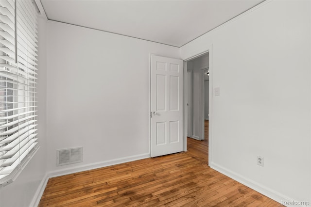 10576 Somerset Ave, Detroit, MI 48224 - unfurnished room featuring wood finished floors, baseboards, and plenty of natural light