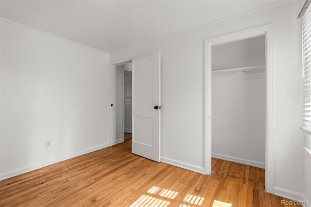 10576 Somerset Ave, Detroit, MI 48224 - unfurnished bedroom with a closet, light wood-type flooring, ornamental molding, and baseboards
