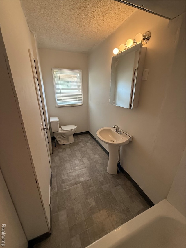1226 E Princeton Ave, Flint, MI 48505 - full bathroom with a textured ceiling and tile patterned floors
