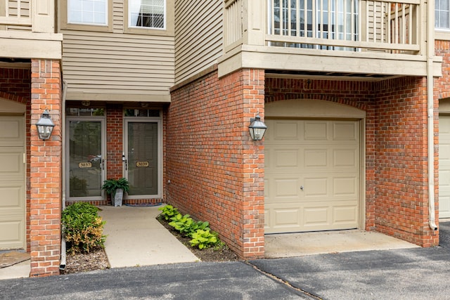 3039 Barclay Way, Ann Arbor, MI 48105 - entrance to property with a balcony, brick siding, and an attached garage