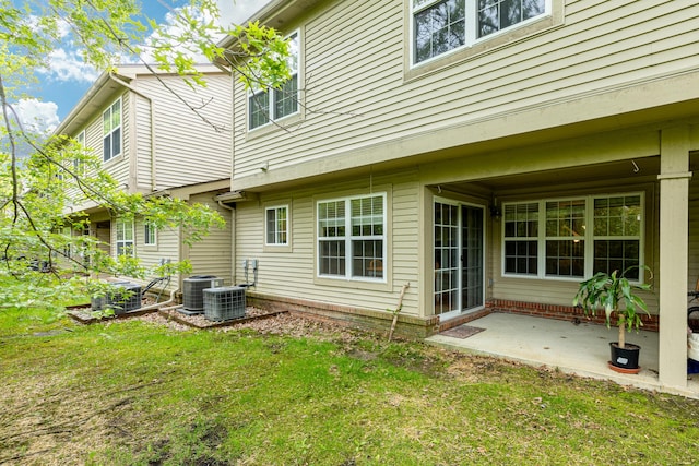 3039 Barclay Way, Ann Arbor, MI 48105 - rear view of property featuring a yard, central AC, and a patio area