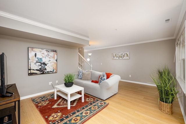 3039 Barclay Way, Ann Arbor, MI 48105 - living room with light wood-style flooring, ornamental molding, baseboards, and stairway