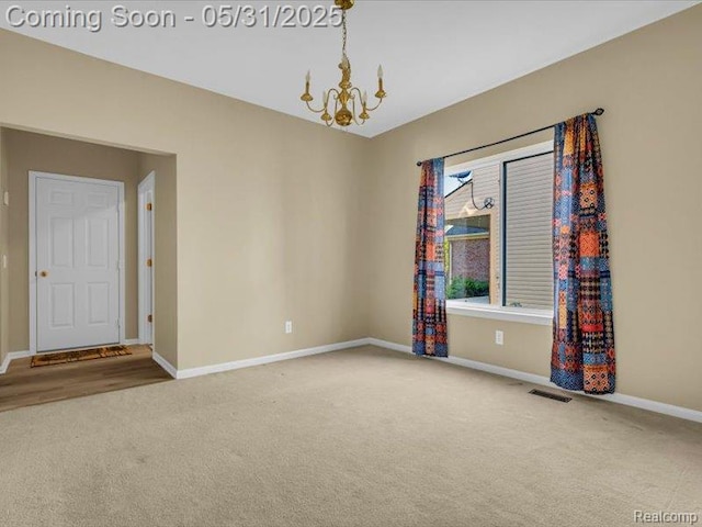 1387 Hartland Dr, Troy, MI 48083 - carpeted empty room featuring a chandelier and baseboards