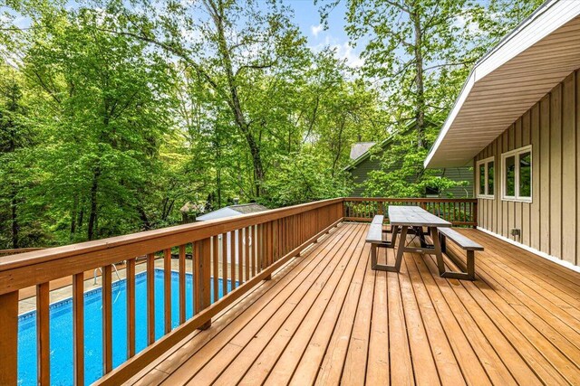 14438 Spring Creek Dr, New Buffalo, MI 49117 - deck with an outdoor pool and outdoor dining area