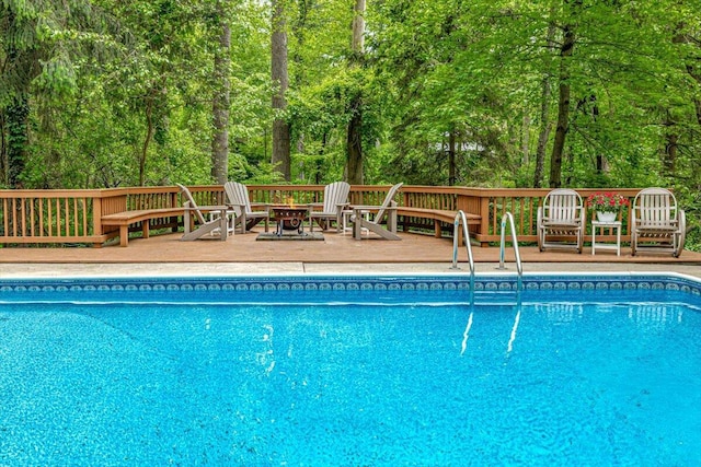 14438 Spring Creek Dr, New Buffalo, MI 49117 - swimming pool with an outdoor fire pit and a wooden deck