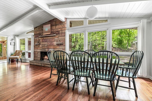 14438 Spring Creek Dr, New Buffalo, MI 49117 - dining space with hardwood / wood-style floors and a fireplace
