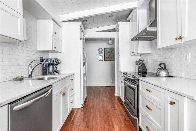 14438 Spring Creek Dr, New Buffalo, MI 49117 - kitchen featuring stainless steel appliances, wall chimney range hood, a sink, decorative backsplash, and wood ceiling with exposed beams