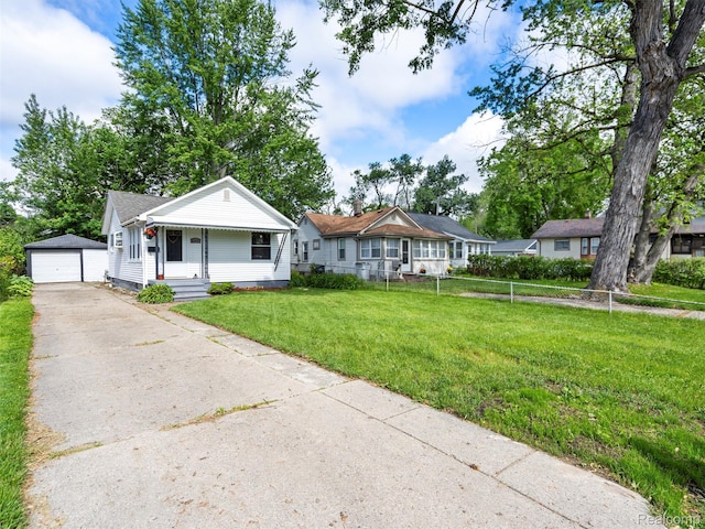 23091 Berdeno Ave, Hazel Park, MI 48030 - view of front of house with an outbuilding, a garage, and asphalt driveway