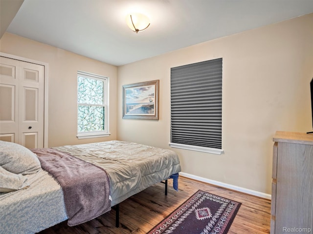23091 Berdeno Ave, Hazel Park, MI 48030 - bedroom with wood finished floors, baseboards, and a closet