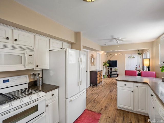 23091 Berdeno Ave, Hazel Park, MI 48030 - kitchen with white appliances, white cabinetry, wood finished floors, and ceiling fan