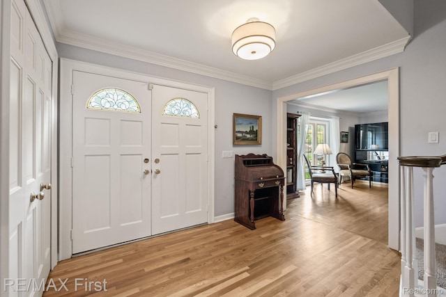 2983 Woodcreek Way, Bloomfield Hills, MI 48304 - foyer with ornamental molding, light wood finished floors, and baseboards